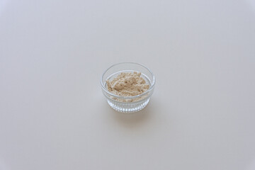 Raw fresh dried adlay flour on light white table.