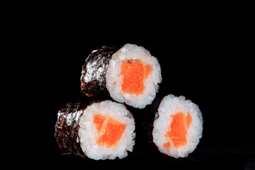 Cold cooked rice dressed with vinegar that is shaped into pieces and topped with raw or cooked fish, or formed into a roll with fish, egg, or vegetables and often wrapped in seaweed.