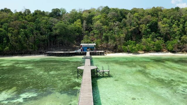 Drone view over park entrance pier on tropical island