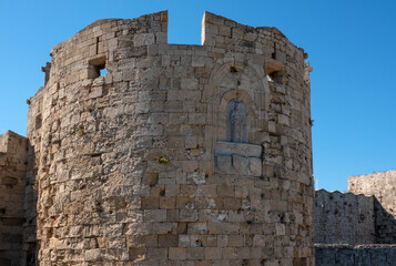 Stone towers with Christian reliefs.