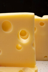 Swiss cheese collection, yellow emmentaler cheese with round holes