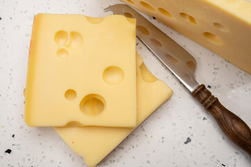 Swiss cheese collection, yellow emmentaler cheese with round holes