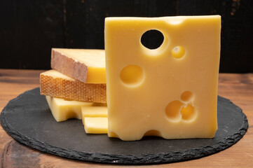 Swiss cheese collection, emmentaler with holes,  gruyere, appenzeller fondue cheeses
