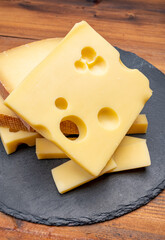 Swiss cheese collection, emmentaler with holes,  gruyere, appenzeller fondue cheeses