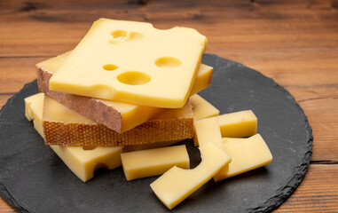 Swiss cheese collection, emmentaler with holes,  gruyere, appenzeller fondue cheeses