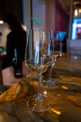 Glass of cold dry Italian pinot grigio white wine served in Italian bar