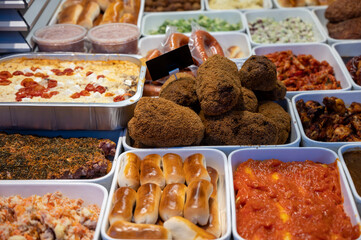 Assortment of gourmet meat dishes in butchery delicatessen shop