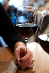 Tasting of dry Italian primitivo red wine in Italian cantina restaurant in Puglia