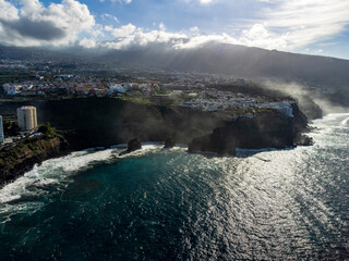 Aerial view on black lava rocks and Atlantic ocean in small village Punta Brava near Puerto de la Cruz, Tenerife, Canary islands