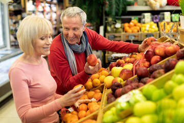 Beautiful senior woman shopping with her husband