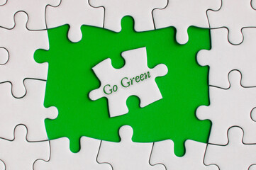 Go green text on jigsaw puzzle. Nature Concept