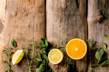 Fresh organic sliced citrus and herbs branches