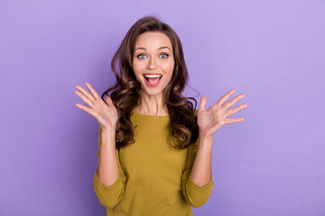 Photo of astonished cheerful person raise arms palms open mouth cant believe isolated on purple...