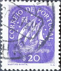 Portugal - circa 1943: a postage stamp from Portugal, showing a historical Caravel with sails from...