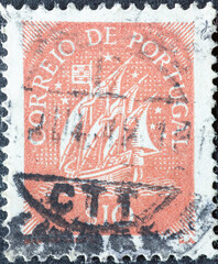 Portugal - circa 1949: a postage stamp from Portugal, showing a historical Caravel with sails from the 15th Century