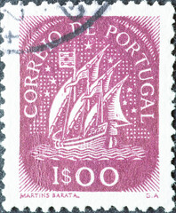 Portugal - circa 1948: a postage stamp from Portugal, showing a historical Caravel with sails from...