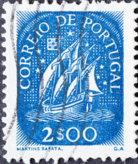 Portugal - circa 1949: a postage stamp from Portugal, showing a historical Caravel with sails from...