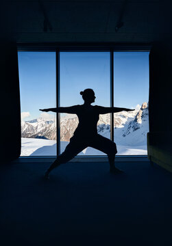 Yoga practice meditation in the room with mountain view