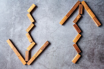 Arrow design from wooden puzzles on black background.