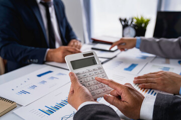 Business team presentation meeting Asian Men Finance Executive discusses meetings to plan work, investment projects, and trading strategy for trading partners. Finance and Accounting