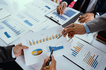 Business team presentation meeting Asian Men Finance Executive discusses meetings to plan work, investment projects, and trading strategy for trading partners. Finance and Accounting