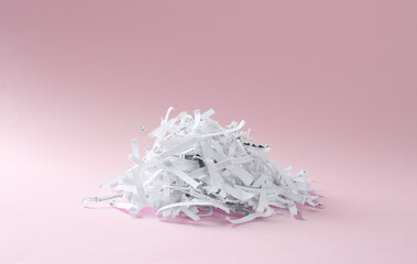 Heap of shredded paper strips on violet background