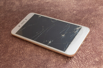 Broken glass of smart phone on floor, broken smart phone