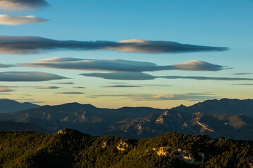 Obraz premium Sunset and wind clouds in La Garrotxa, Girona, Spain