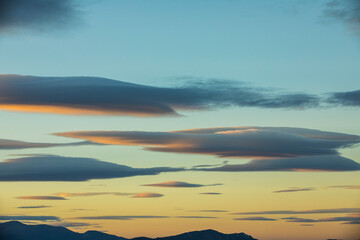 Fototapeta na wymiar Sunset and wind clouds in La Garrotxa, Girona, Spain