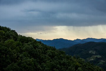 Fototapeta na wymiar Sunset and dramatic clouds in La Garrotxa, Spain