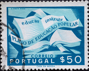 Portugal - circa 1954: a postage stamp from Portugal, showing an Open Book with a ribbon. National...