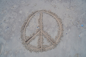 a peace sign was  drawn in the sand