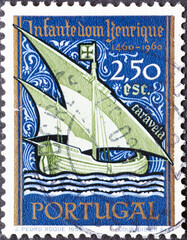 Portugal - circa 1960: a postage stamp from Portugal, showing a sailing ship. caravel Henry the Navigator, 500th Anniversary of Death. - obrazy, fototapety, plakaty