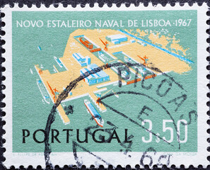 Portugal - circa 1967: a postage stamp from Portugal, showing the Shipyard, Margueira, Lisbon....