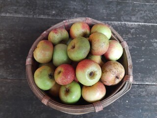 Apple fruits in Bamboo Basket. It is a most popular fruits in all over world. It's found many vitamins, Which helps us fight diseases. It is found everywhere in the world.
