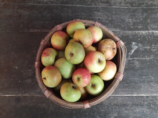 Apple fruits in Bamboo Basket. It is a most popular fruits in all over world. It's found many vitamins, Which helps us fight diseases. It is found everywhere in the world.
