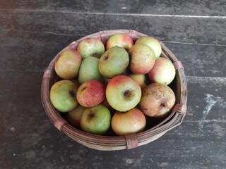 Apple fruits in Bamboo Basket. It is a most popular fruits in all over world. It's found many vitamins, Which helps us fight diseases. It is found everywhere in the world.
