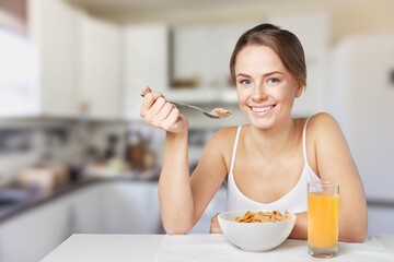 Young calm smiling happy housewife woman eat breakfast. Healthy diet lifestyle concept