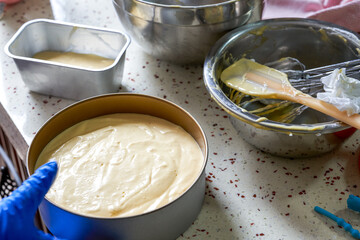 A chef is making a cake