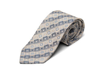 Studio photo of a man's tie rolled up. The background is blue.