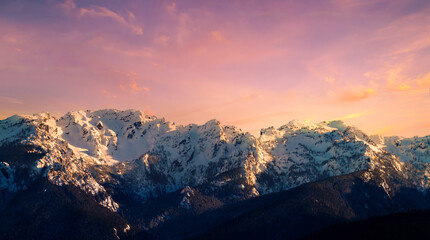 Beautiful view of the sunset in the snow mountains, Vancouver, Canada.
