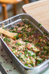 A bowl of fresh pork chive bun stuffing
