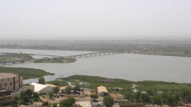 Kennedy Bridge in Niamey Connecting the North and South of the city over the Niger river on a Hazy, Cloudy Day