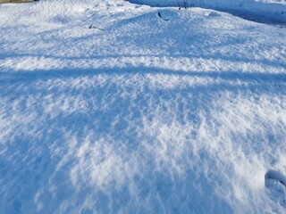 winter day in the Russian village snow well blue sky