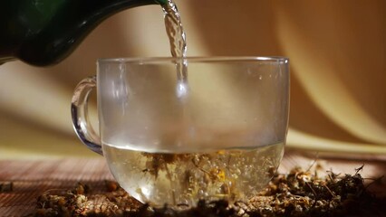 Pouring chamomile tea herbal remedy for insomnia