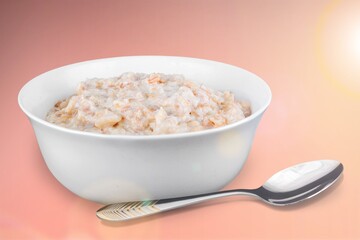 Tasty breakfast Oatmeal porridge in white bowl