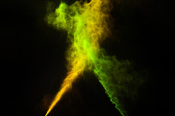 Freeze motion of colorful dust explosion on black background for Happy Holi