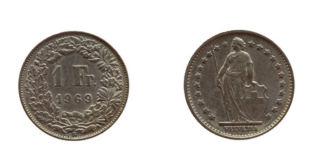 Switzerland - circa 1969: a 1 Franc coin of Switzerland with flowers and twigs around the number. The allegorical female figure Helvetica with spear and shield