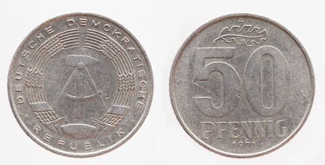 Germany East GDR - circa 1971: a 50  Pfenning coin of the GDR with the Hammer and Zirkle coat of...
