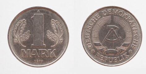 Germany East GDR - circa 1977: a 1 Mark coin of the GDR with the Hammer and Zirkle coat of arms of...